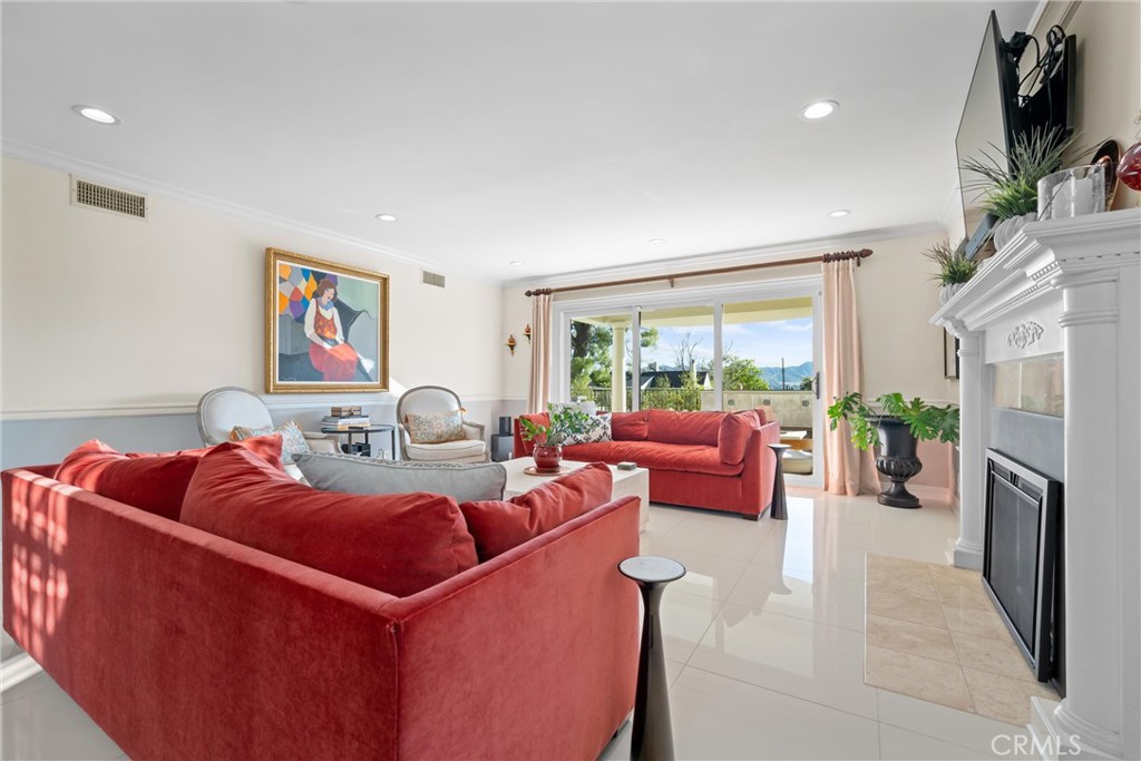 913 Sherlock Drive Burbank, CA 91501 - Photo 8 of 53 a living room with furniture a large window and a flat screen tv