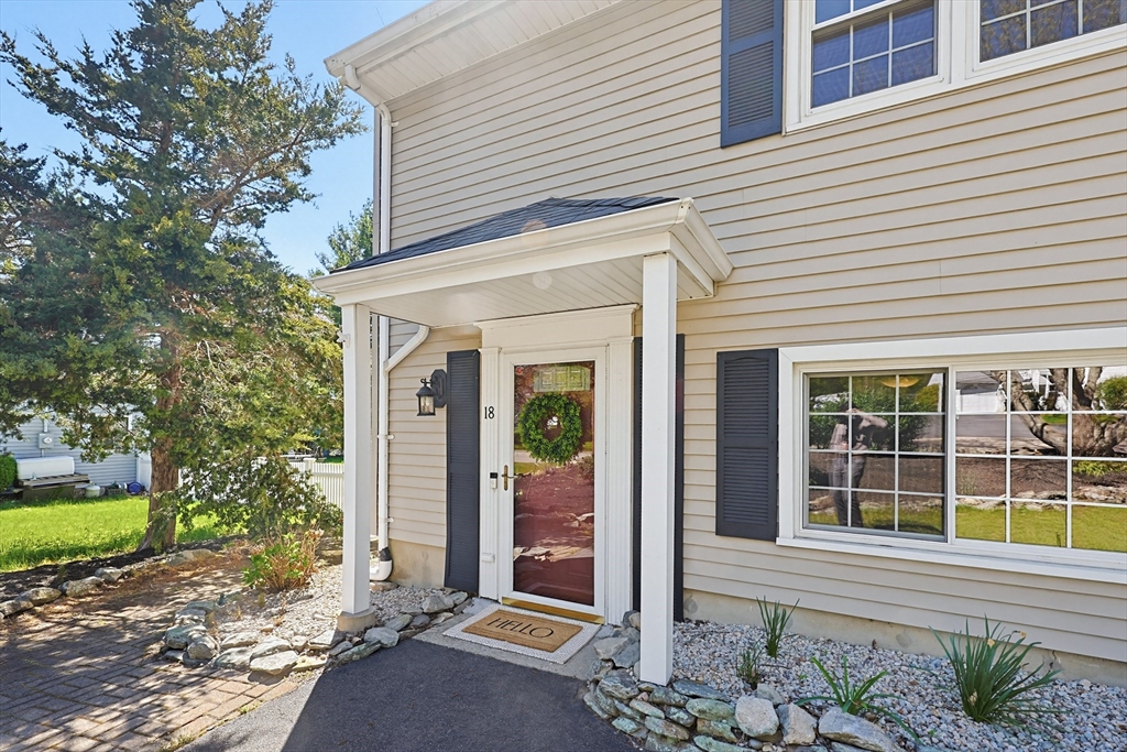 18 Anchorage Road Franklin, MA 02038 - Photo 3 of 42 a front view of a house with a garden