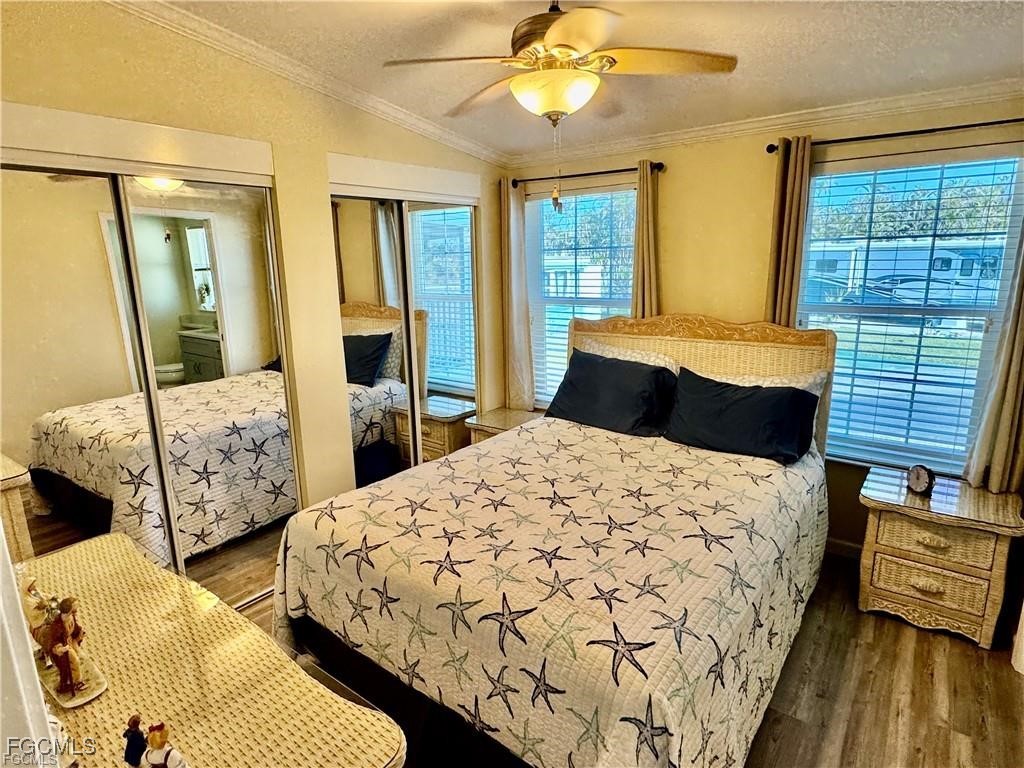 19681 Summerlin Road, Unit 217 Fort Myers, FL 33908 - Photo 12 of 24 a bedroom with two beds and a window
