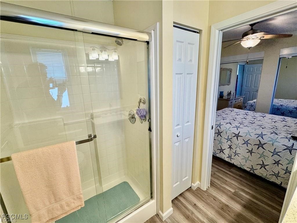 19681 Summerlin Road, Unit 217 Fort Myers, FL 33908 - Photo 13 of 24 a bedroom with a bed and a mirror