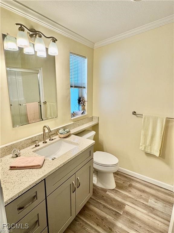 19681 Summerlin Road, Unit 217 Fort Myers, FL 33908 - Photo 16 of 24 a bathroom with a granite countertop sink mirror vanity and toilet
