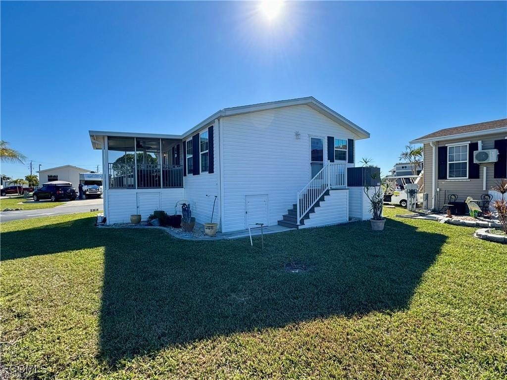19681 Summerlin Road, Unit 217 Fort Myers, FL 33908 - Photo 23 of 24 a view of house with backyard