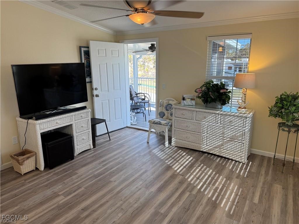 19681 Summerlin Road, Unit 217 Fort Myers, FL 33908 - Photo 4 of 24 a living room with furniture and a flat screen tv