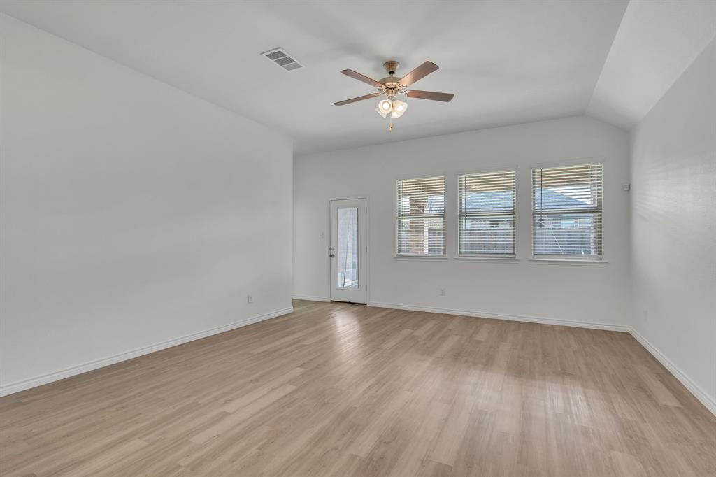 1009 Azure Lane Celina, TX 75009 - Photo 12 of 20 wooden floor in an empty room with a window