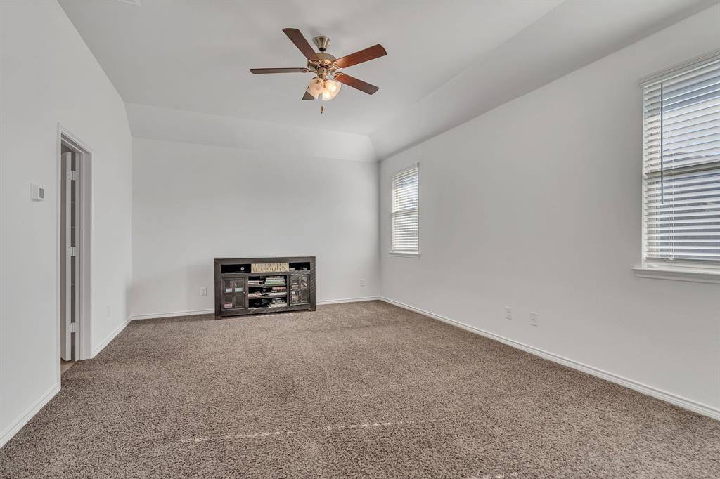 1009 Azure Lane Celina, TX 75009 - Photo 14 of 20 an empty room with windows and ceiling fan