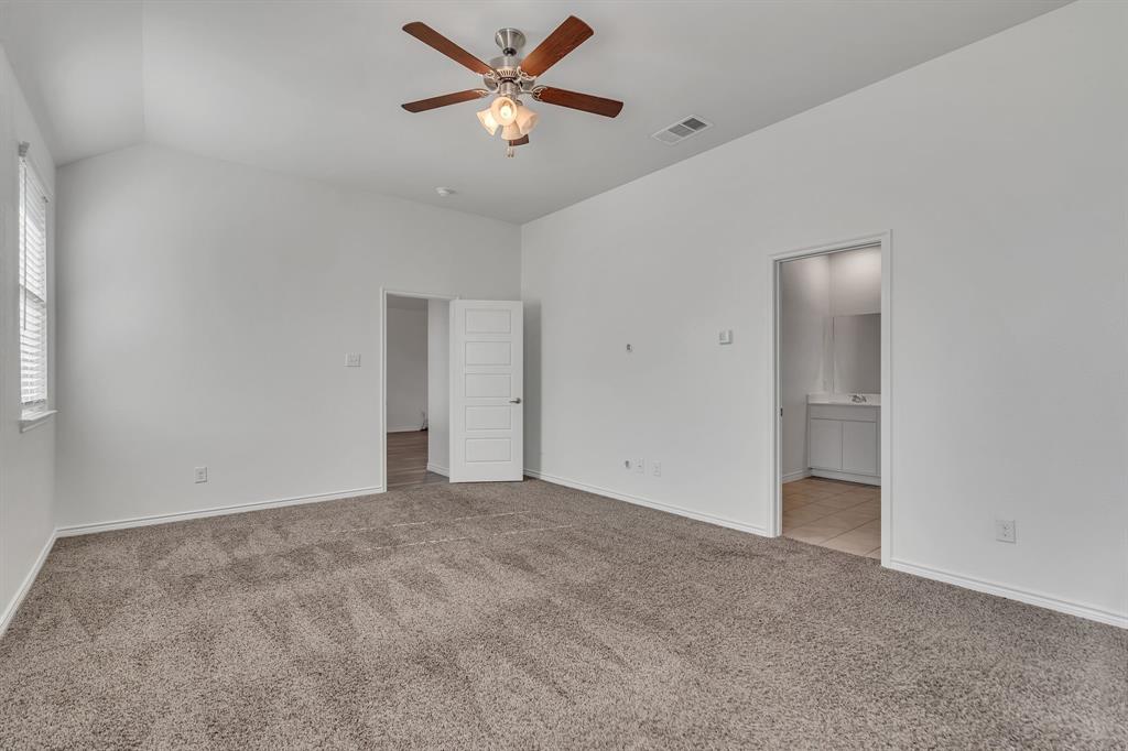 1009 Azure Lane Celina, TX 75009 - Photo 15 of 20 a view of an empty room with a fan
