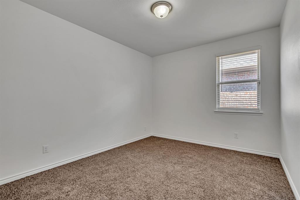 1009 Azure Lane Celina, TX 75009 - Photo 17 of 20 an empty room with a window