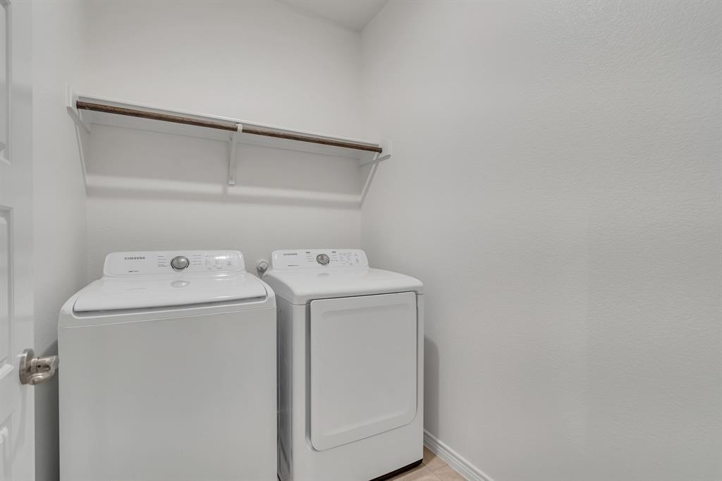 1009 Azure Lane Celina, TX 75009 - Photo 20 of 20 a utility room with dryer and washer