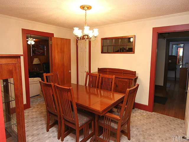 1948 Johnston County Road Benson, NC 27504 - Photo 3 of 13 a view of a dining room with furniture and wooden floor