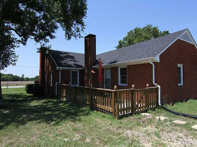 1948 Johnston County Road Benson, NC 27504 - Photo 10 of 13 a view of house with backyard and deck