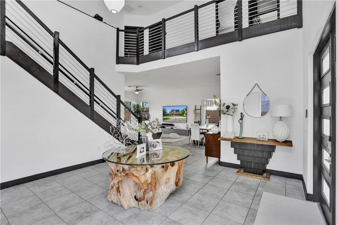 16001 Southwest 136 Way Miami, FL 33196 - Photo 11 of 66 a living room with couches and kitchen view with wooden floor