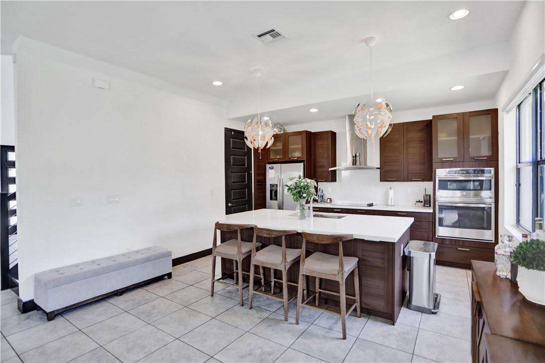 16001 Southwest 136 Way Miami, FL 33196 - Photo 17 of 66 a large kitchen with a table and chairs in it