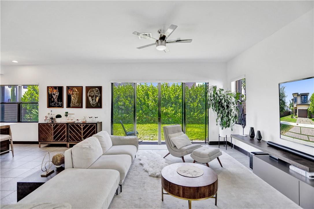 16001 Southwest 136 Way Miami, FL 33196 - Photo 28 of 66 a living room with furniture and a large window