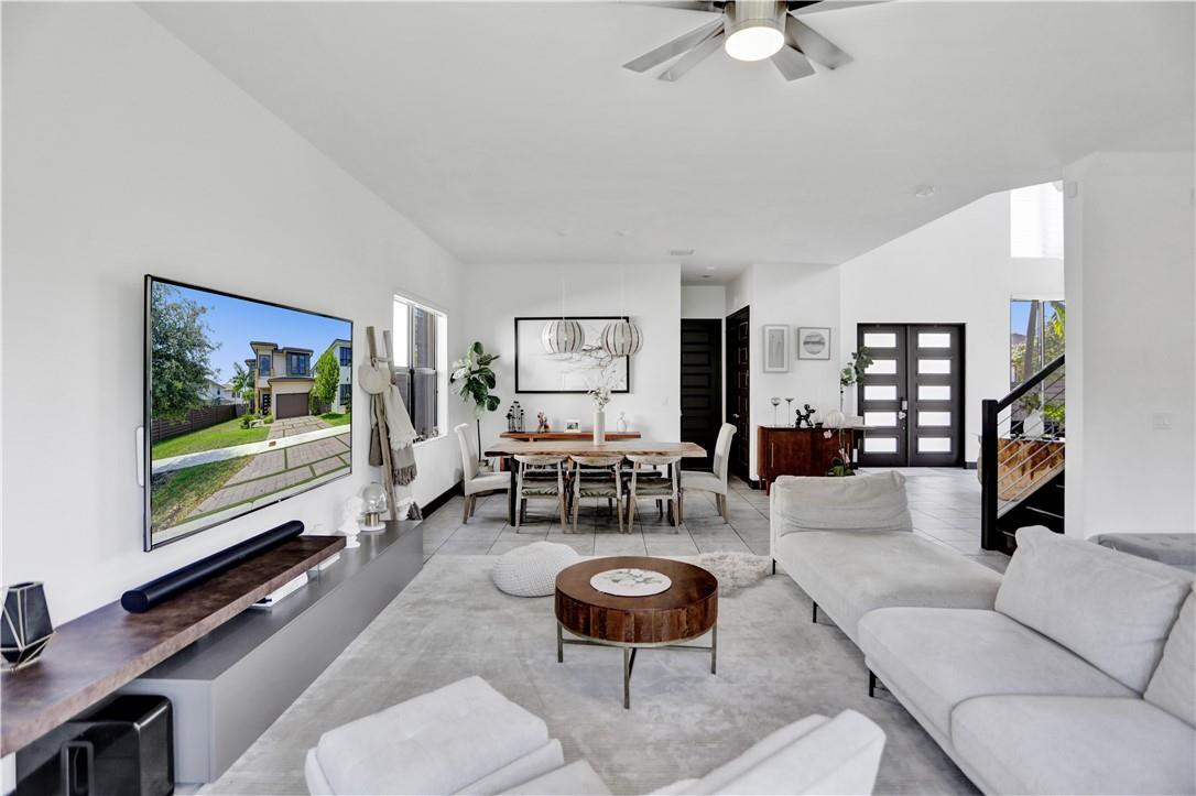 16001 Southwest 136 Way Miami, FL 33196 - Photo 31 of 66 a living room with furniture and a flat screen tv