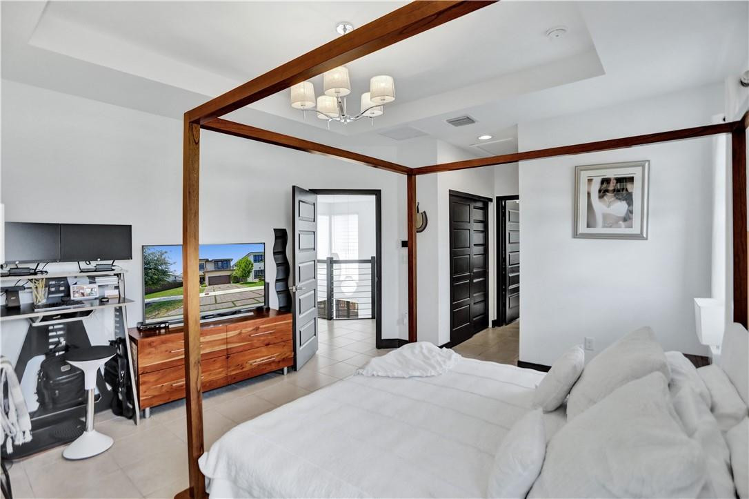 16001 Southwest 136 Way Miami, FL 33196 - Photo 57 of 66 a bedroom with bed and glass door