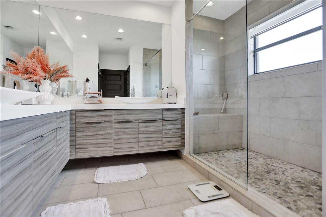 16001 Southwest 136 Way Miami, FL 33196 - Photo 61 of 66 a bathroom with a shower a sink and a mirror