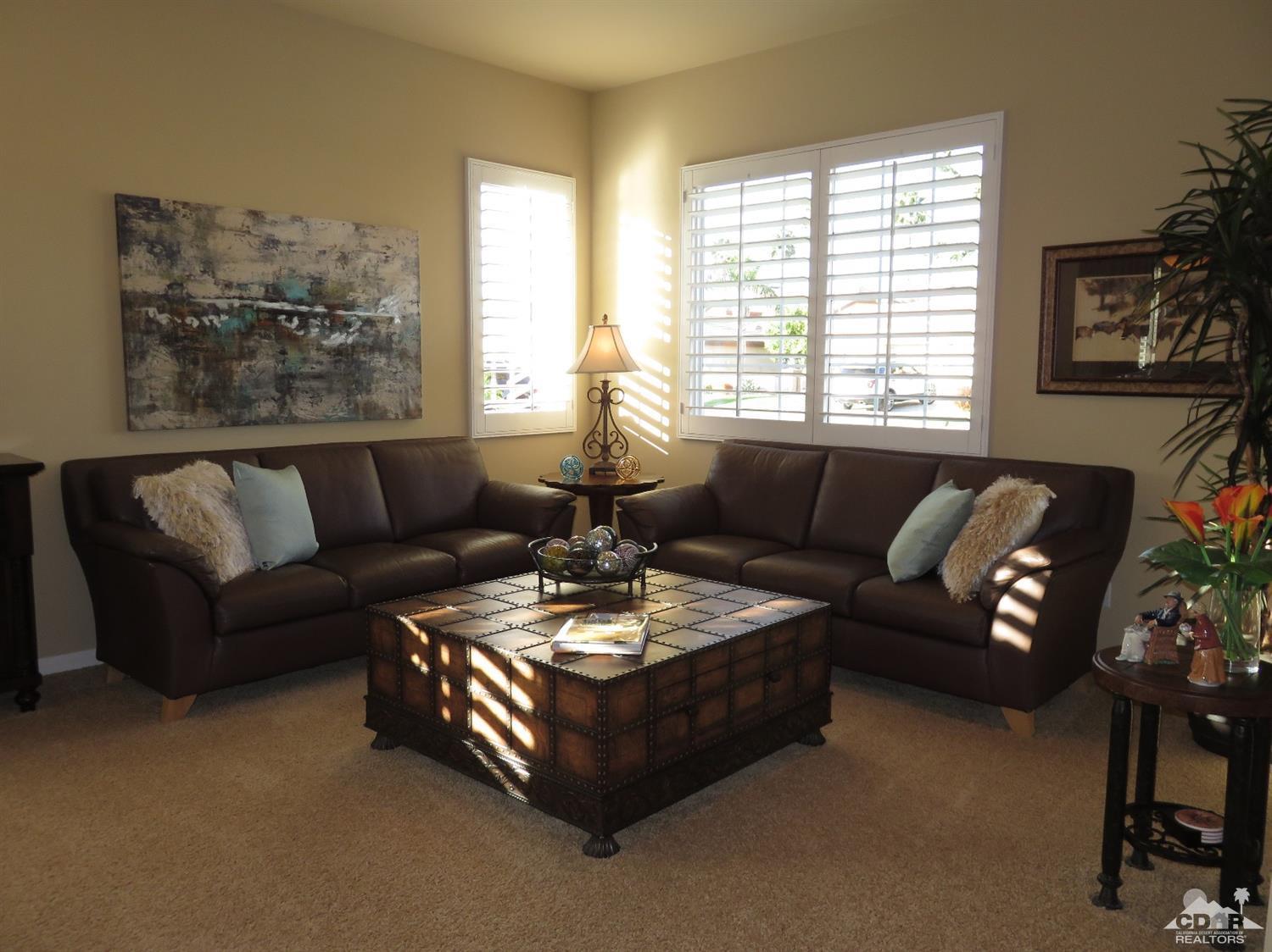 80567 Knightswood Road Indio, CA 92201 - Photo 14 of 57 a living room with furniture and a large window