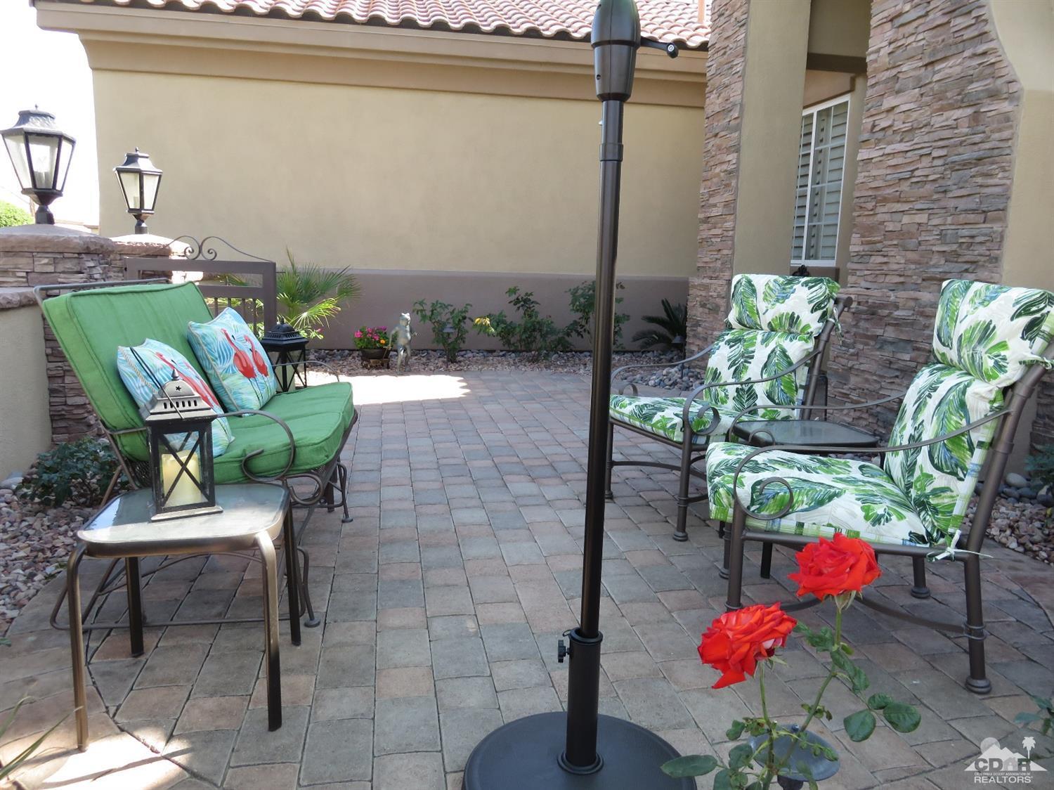 80567 Knightswood Road Indio, CA 92201 - Photo 8 of 57 a backyard of a house with outdoor seating