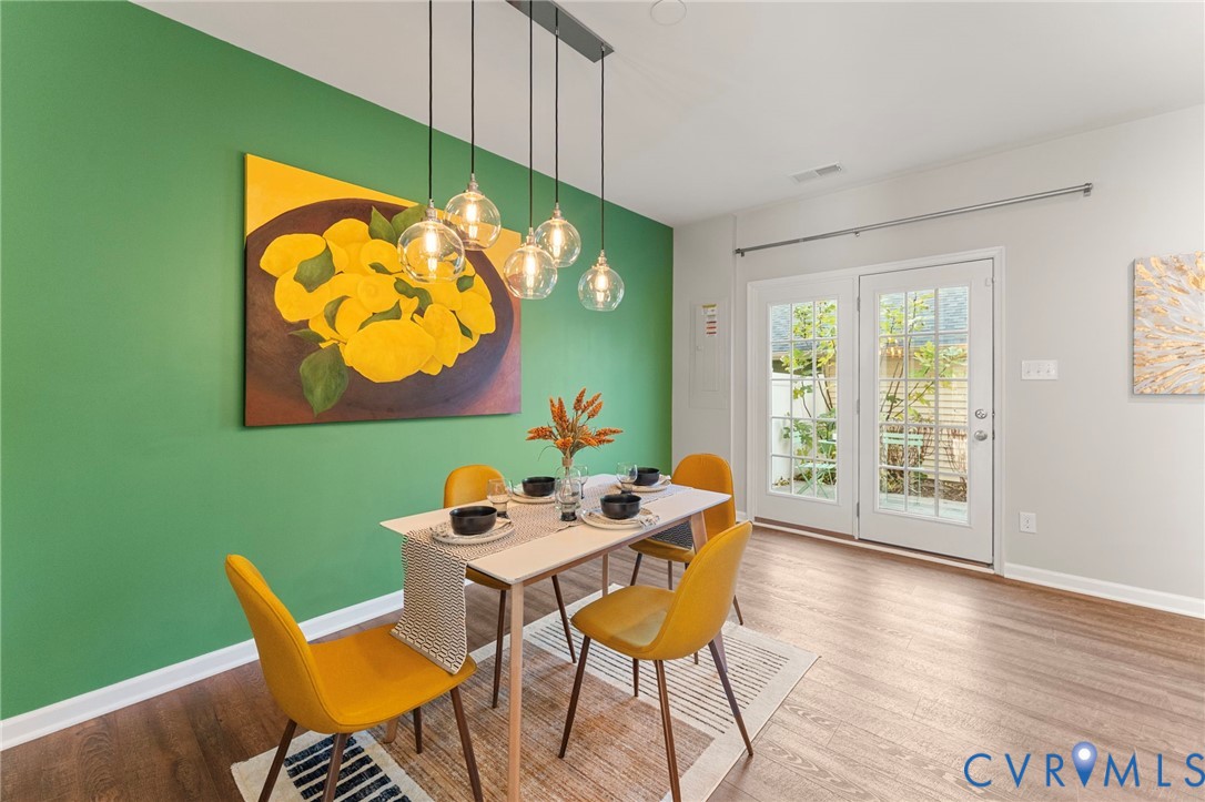 5504 Riverside Heights Way Richmond, VA 23225 - Photo 11 of 29 a dining room with furniture and wooden floor