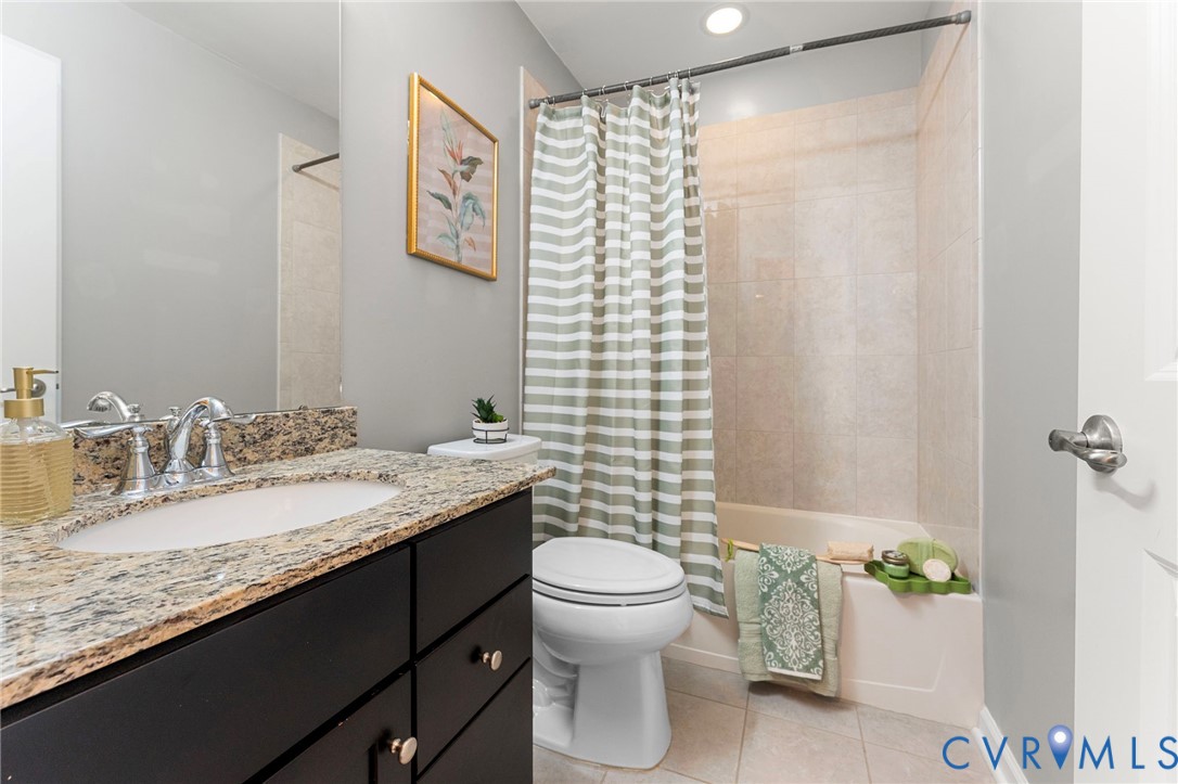 5504 Riverside Heights Way Richmond, VA 23225 - Photo 13 of 29 a bathroom with a granite countertop sink and a mirror