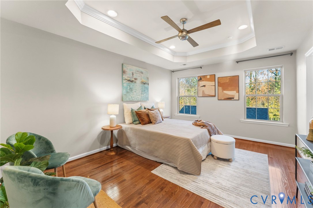 5504 Riverside Heights Way Richmond, VA 23225 - Photo 14 of 29 a bedroom with a bed couch and window