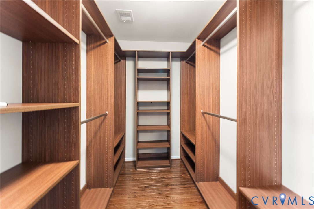 5504 Riverside Heights Way Richmond, VA 23225 - Photo 19 of 29 a view of walk in closet with empty racks