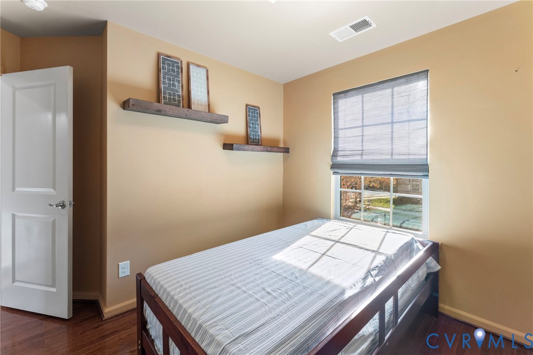 5504 Riverside Heights Way Richmond, VA 23225 - Photo 22 of 29 a bedroom with a bed and a window