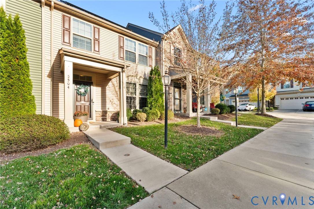 5504 Riverside Heights Way Richmond, VA 23225 - Photo 25 of 29 a front view of a house with a yard