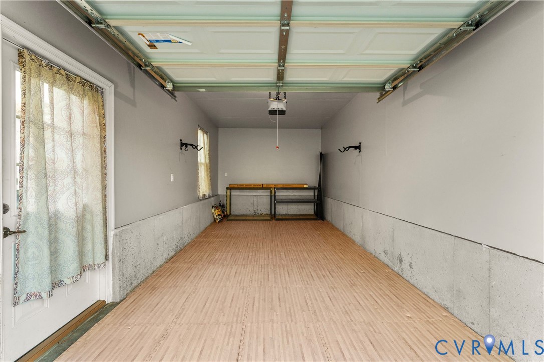 5504 Riverside Heights Way Richmond, VA 23225 - Photo 28 of 29 a view of a hallway with wooden floor and staircase