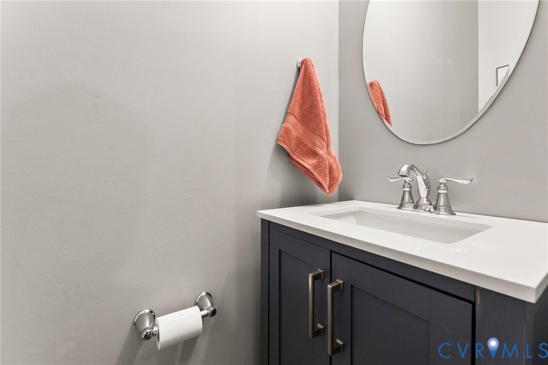 5504 Riverside Heights Way Richmond, VA 23225 - Photo 5 of 29 a bathroom with a sink and a mirror