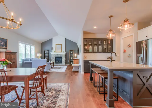 a large kitchen with a table and chairs