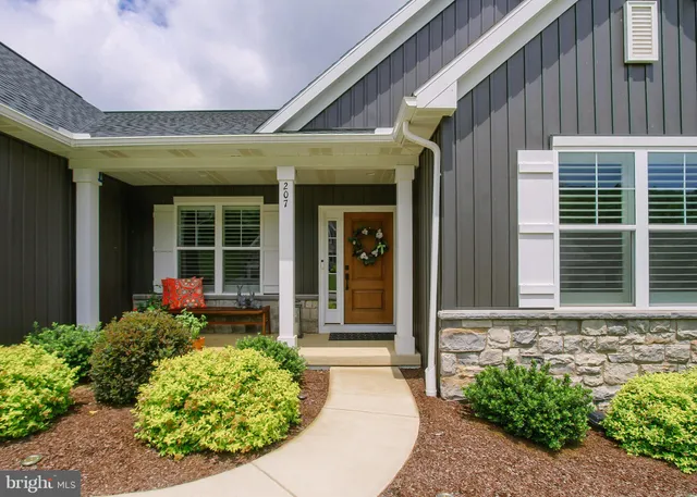 a front view of a house with garden