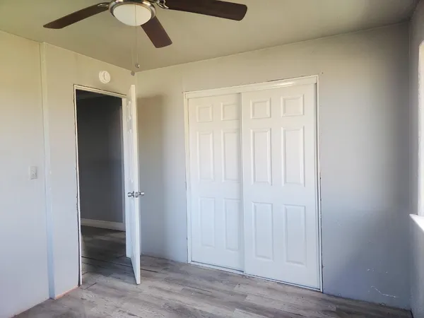 an empty room with wooden floor