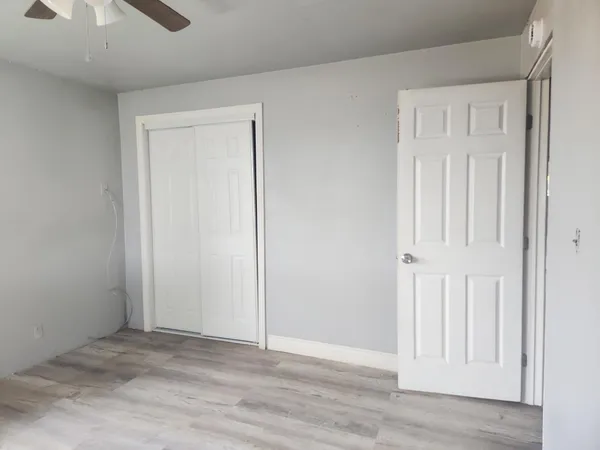 an empty room with wooden floor