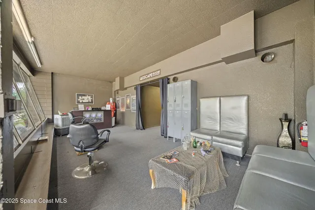 a view of a livingroom with furniture and window