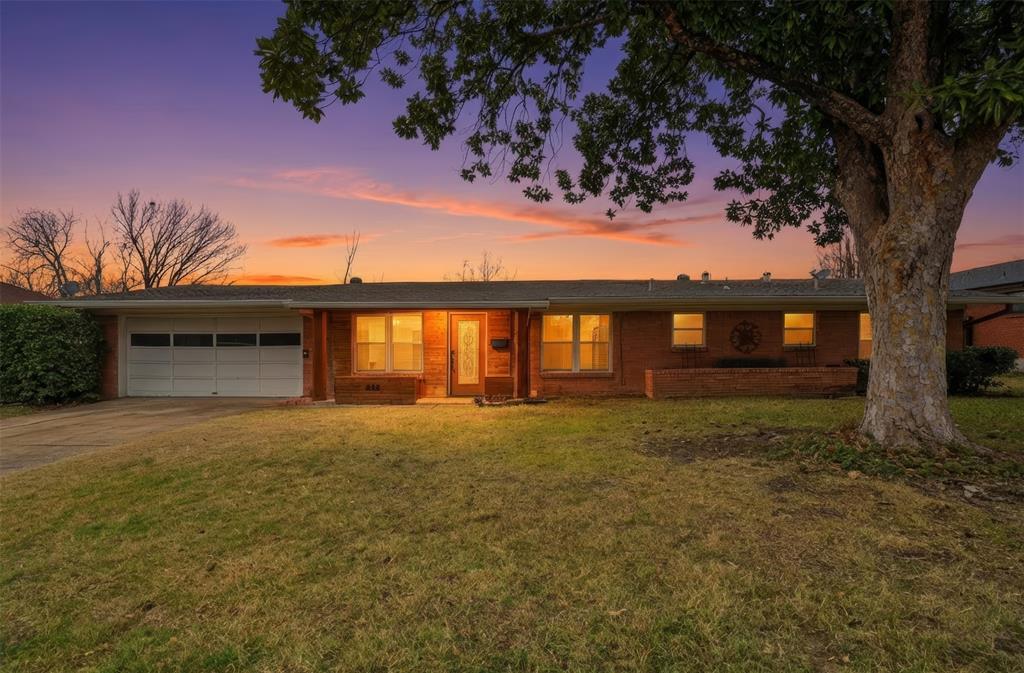 Twilight Photo of the front of the home.