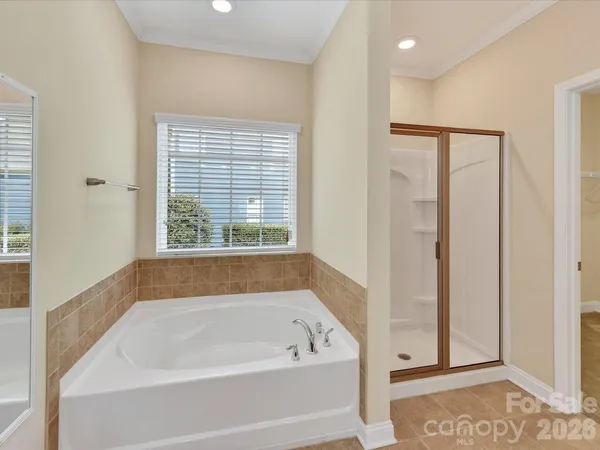 a white bath tub sitting next to a window