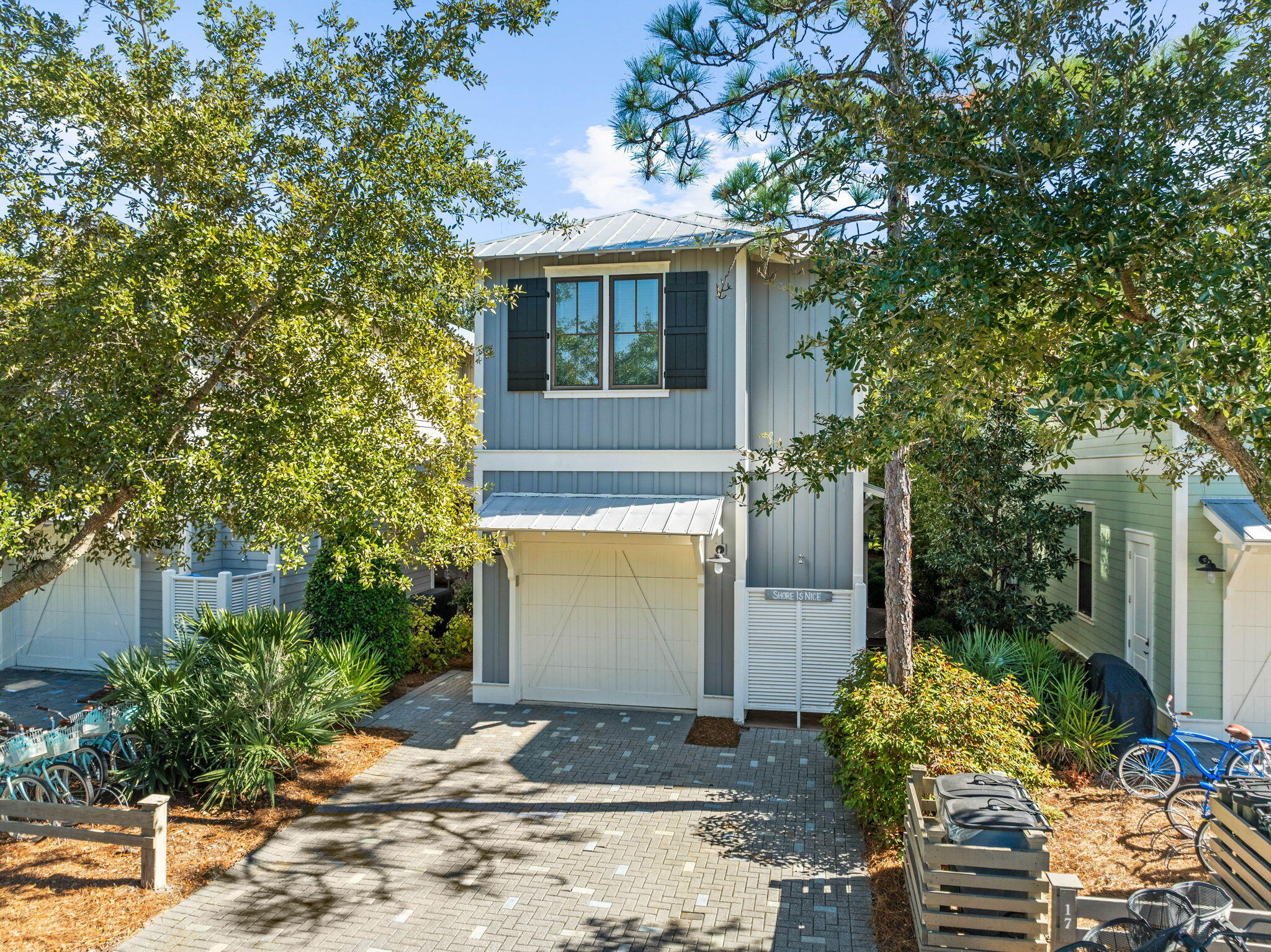 17 Red Basil Drive Santa Rosa Beach, FL 32459 - Photo 39 of 59 a front view of a house with garden