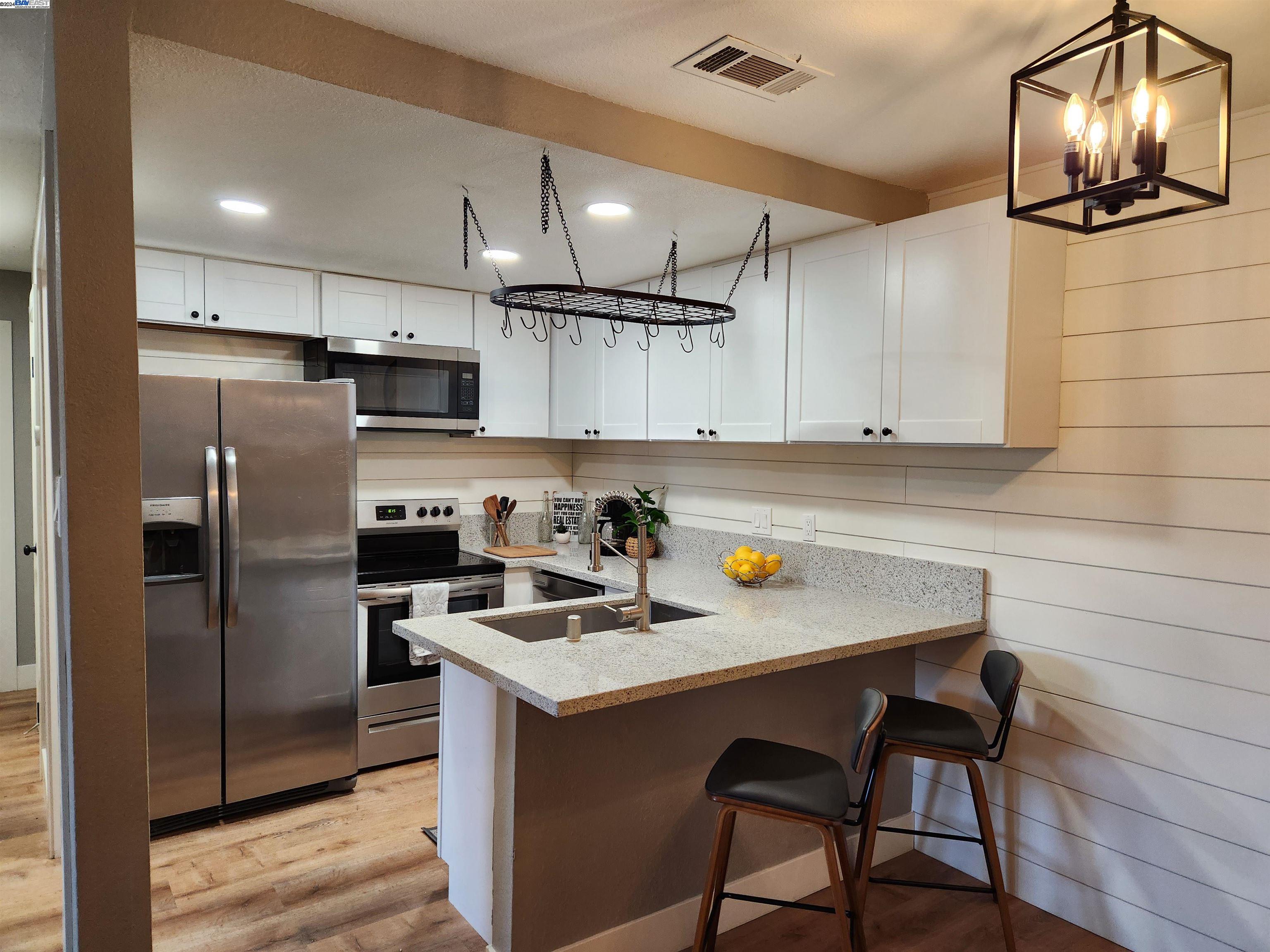3641 Clayton Road, Unit 45 Concord, CA 94521 - Photo 1 of 1 a kitchen with stainless steel appliances a sink a stove a refrigerator and cabinets