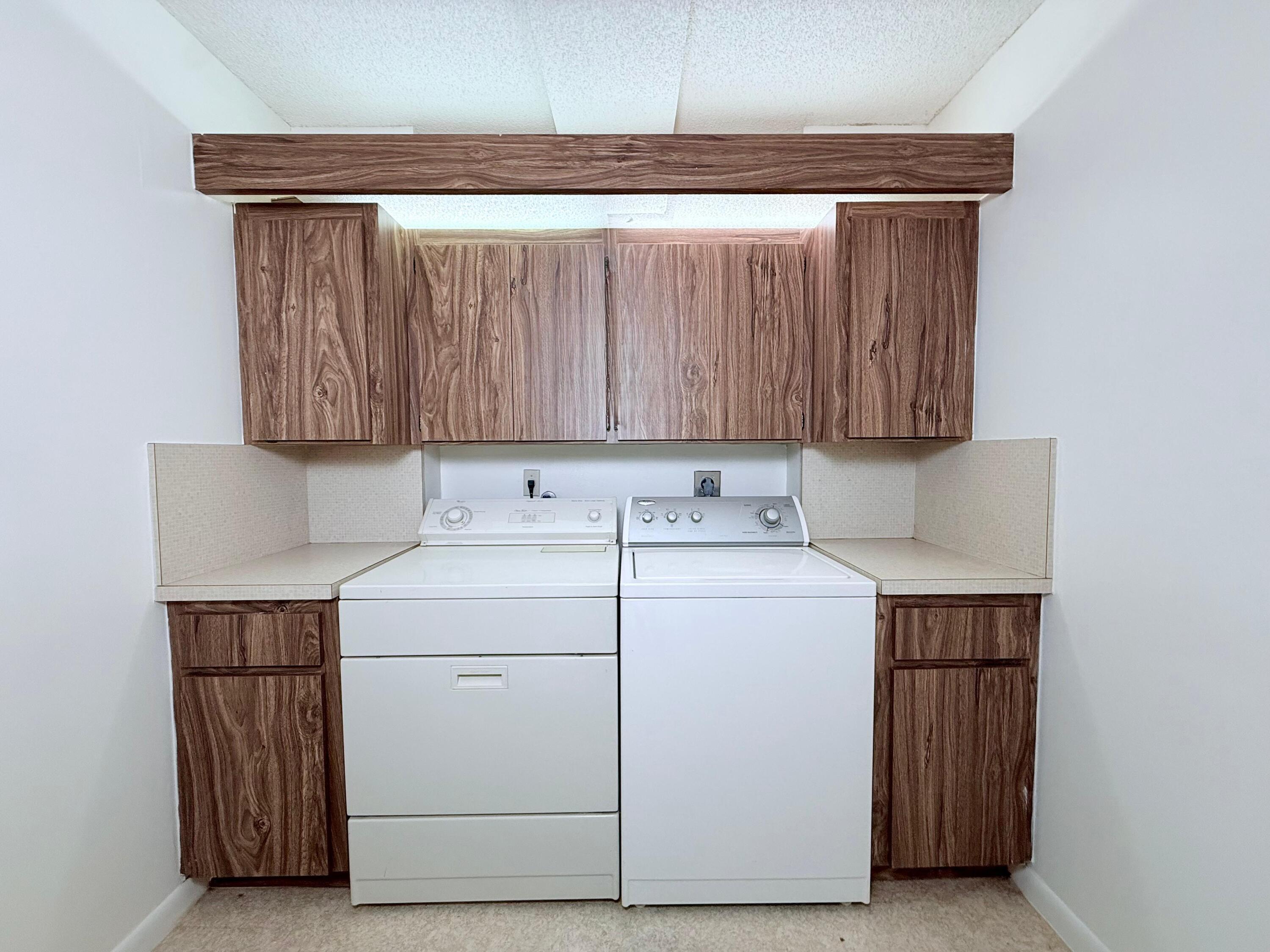 3525 Village Boulevard, Unit 401 West Palm Beach, FL 33409 - Photo 11 of 23 a utility room with dryer and washer