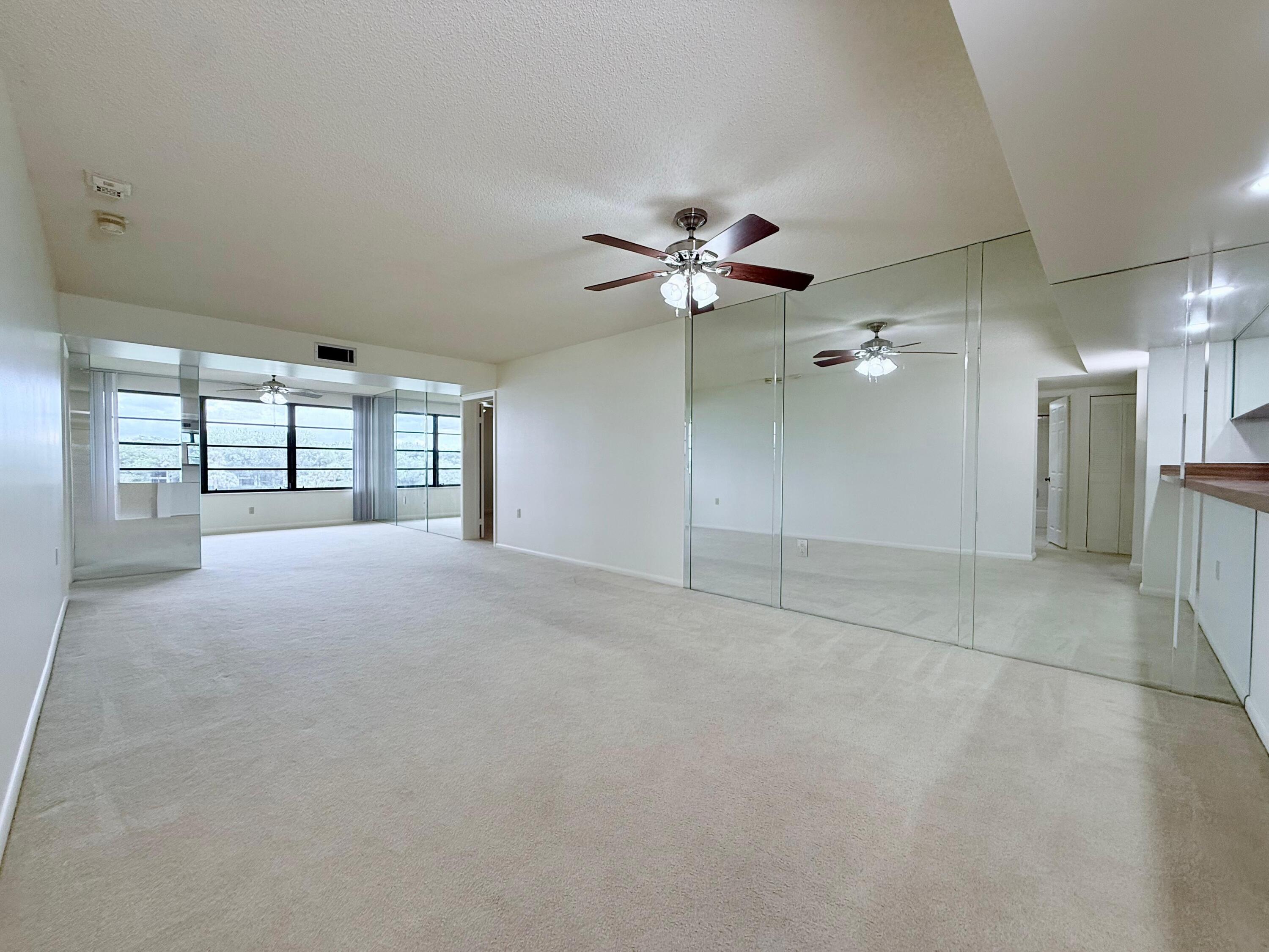 3525 Village Boulevard, Unit 401 West Palm Beach, FL 33409 - Photo 14 of 23 a view of an empty room with a window