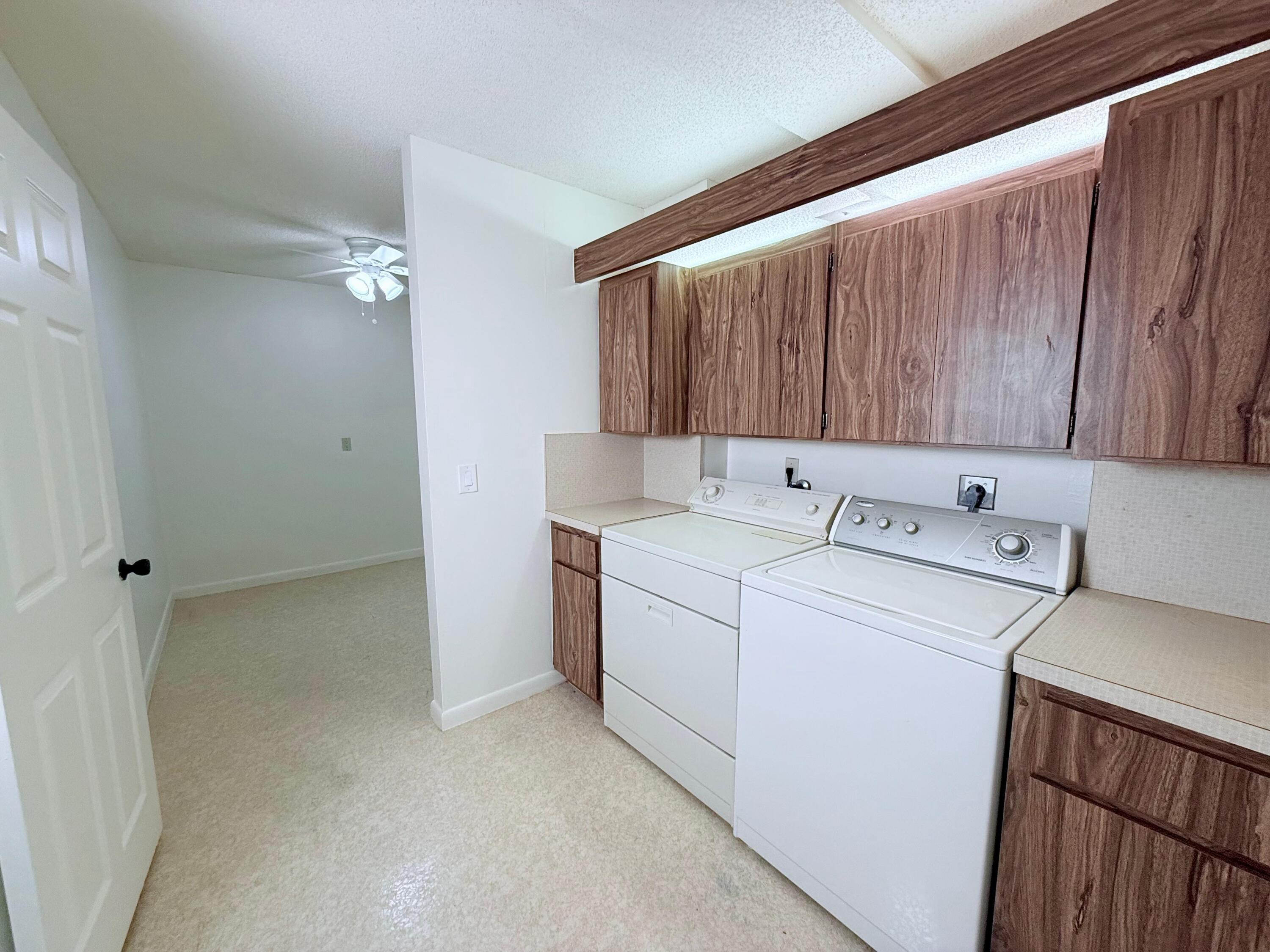 3525 Village Boulevard, Unit 401 West Palm Beach, FL 33409 - Photo 16 of 23 a utility room with dryer and washer