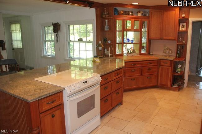 5410 Harper Road Solon, OH 44139 - Photo 4 of 20 Butcher Block counter and a glass showcase cabinet
