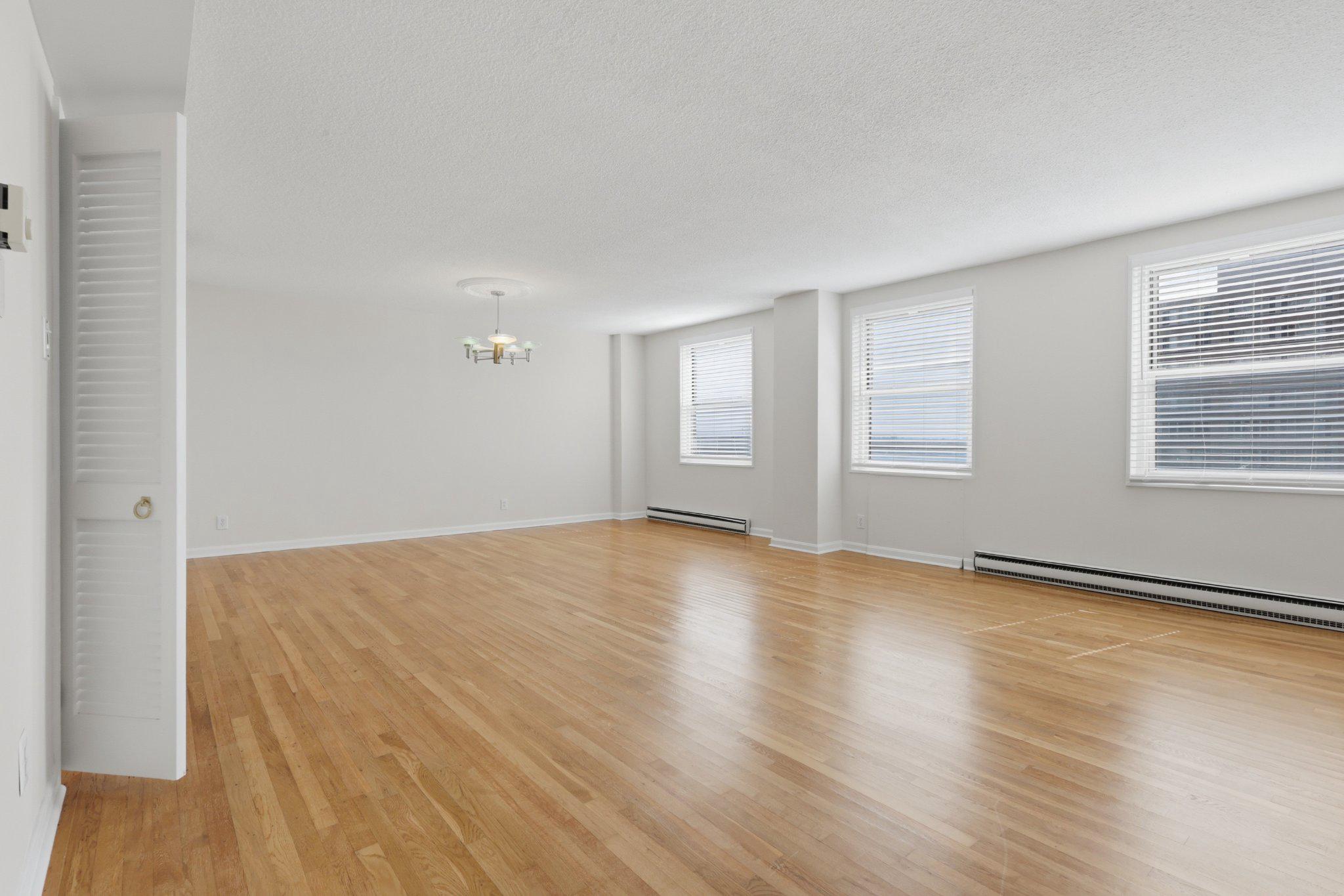 1101 St Paul Street, Unit 1212 Baltimore, MD 21202 - Photo 16 of 36 Spacious, sunlit open living/dining area.