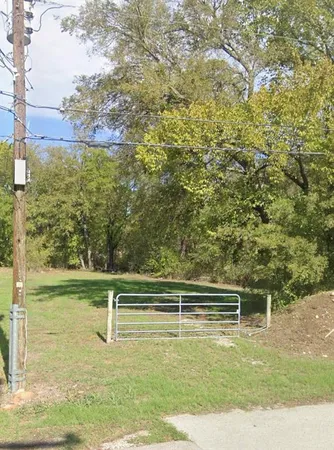 a view of a swimming pool with a yard