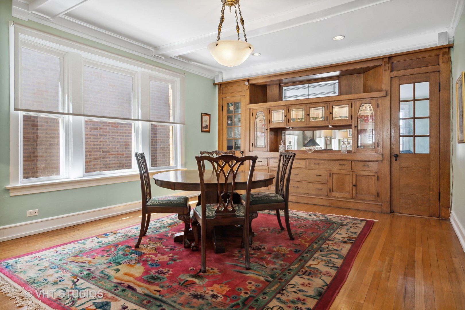 4506 North Beacon Street, Unit 3 Chicago, IL 60640 - Photo 14 of 23 a view of a dining room with furniture window and wooden floor
