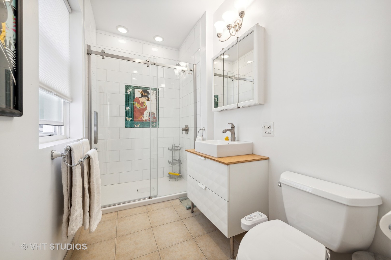 4506 North Beacon Street, Unit 3 Chicago, IL 60640 - Photo 18 of 23 a bathroom with a toilet sink and mirror