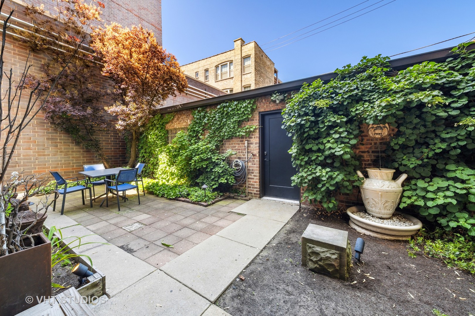 4506 North Beacon Street, Unit 3 Chicago, IL 60640 - Photo 23 of 23 a view of a backyard with sitting area and garden