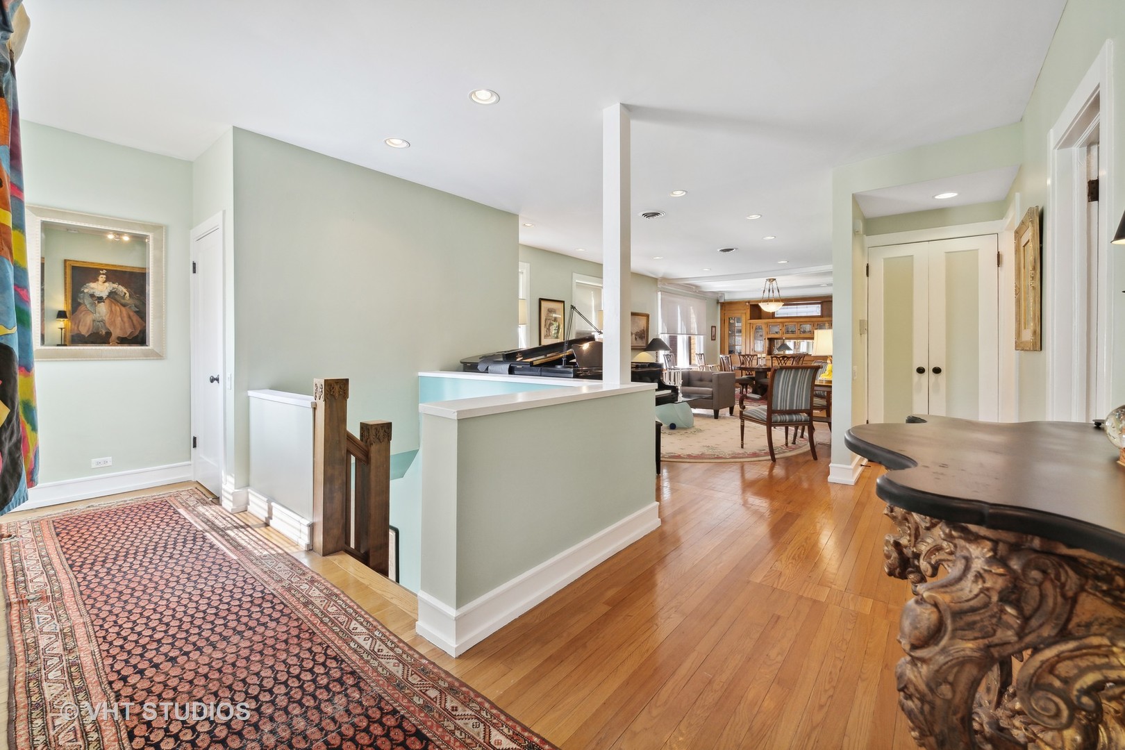 4506 North Beacon Street, Unit 3 Chicago, IL 60640 - Photo 4 of 23 a living room with stainless steel appliances kitchen island granite countertop wooden floor a dining table and chairs