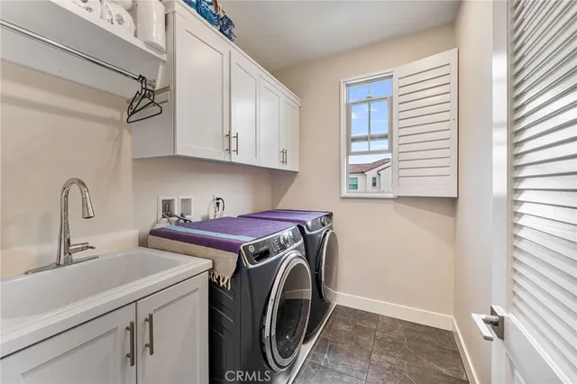 a view of outdoor space with chairs and iron fence
